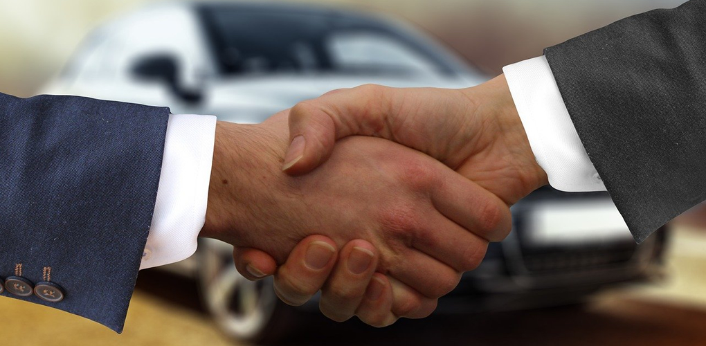 hand shake and car